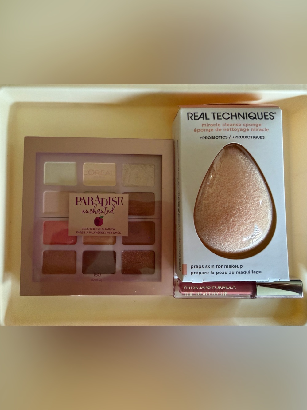 Real Techniques Cleanse Sponge, PF lipstick, & L’Oreal eyeshadow palette